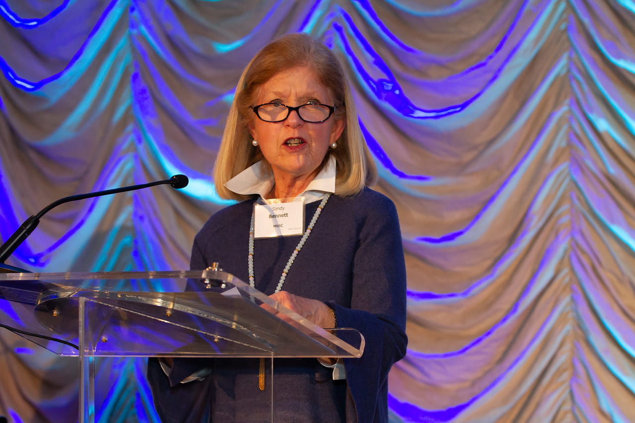Bennett accepting award