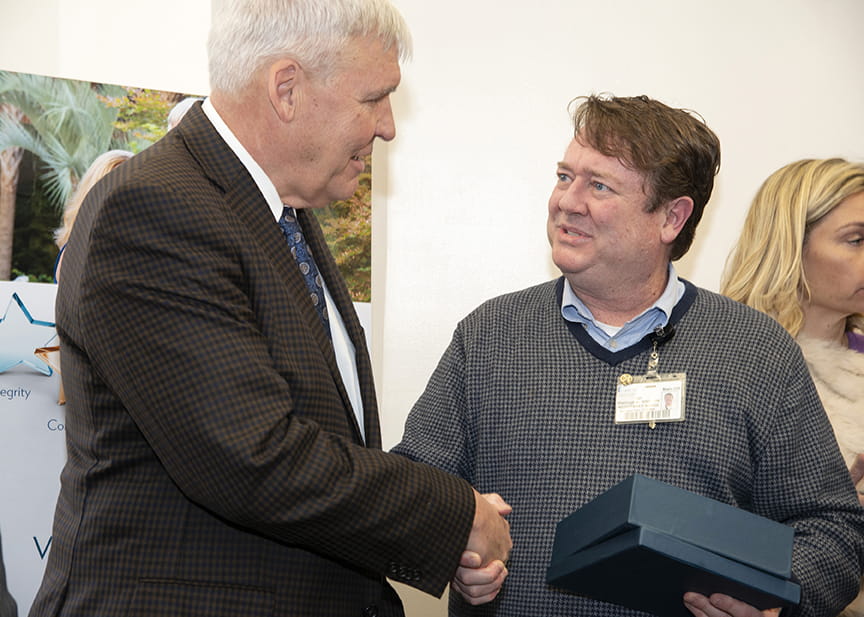 President Cole and Wellington shake hands 