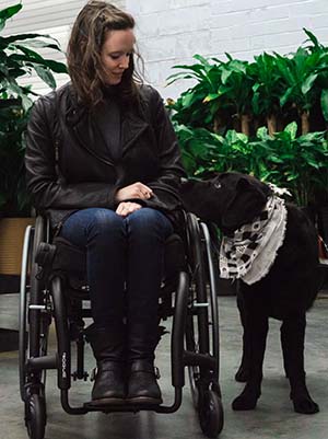 MUSC Center for Workplace Well-Being’s Ryan Boselowitz with her service dog, Lincoln.